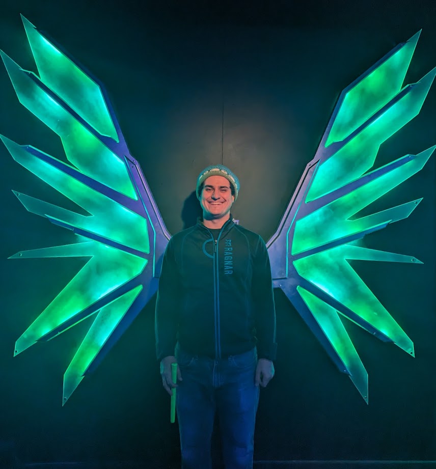 Image of myself (Alec) with light-up wings behind me